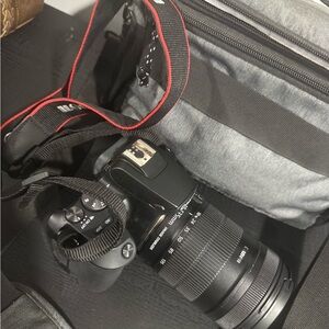 Canon Black DSLR Camera with Gray Bag